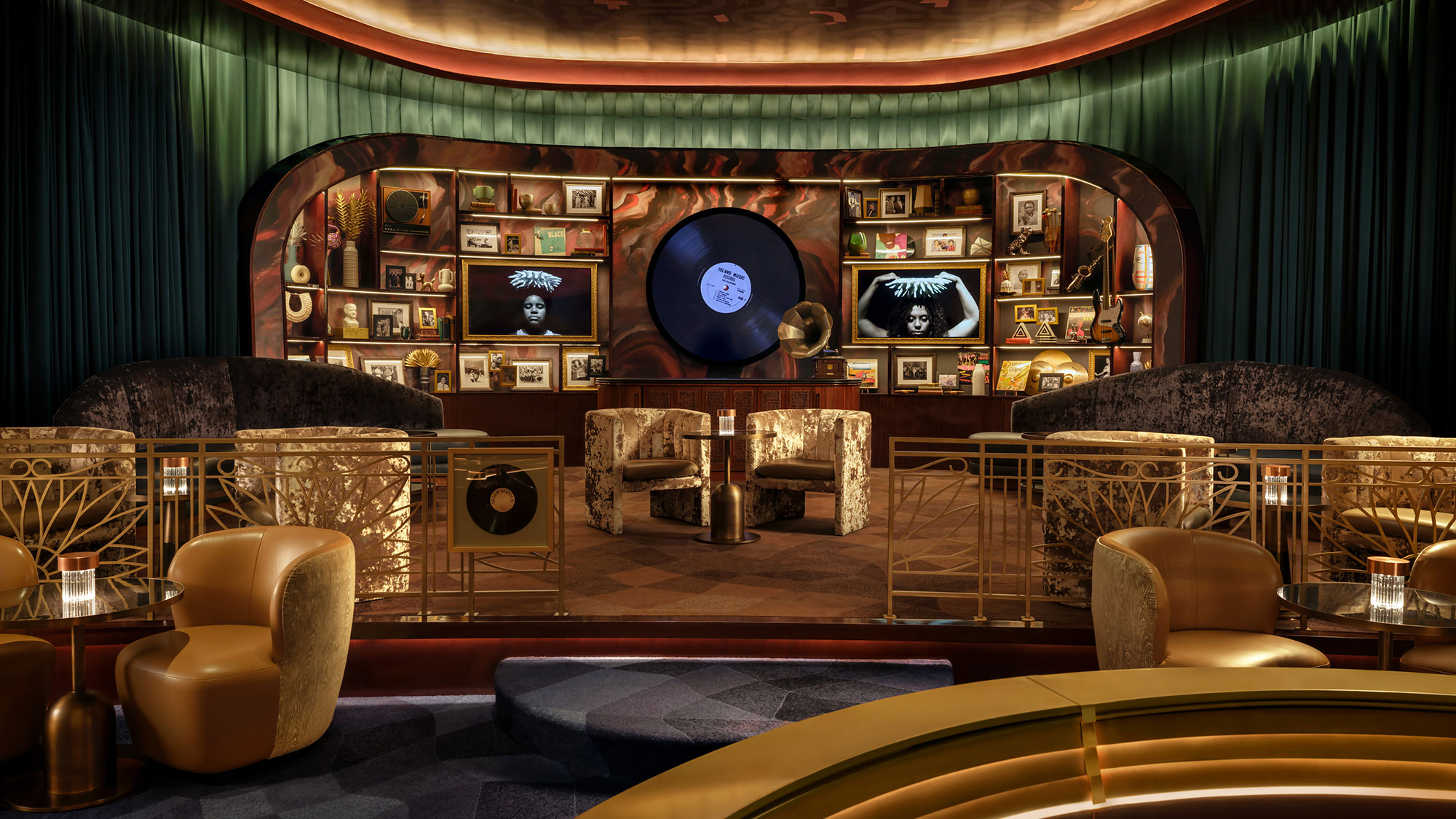 A room with a couch and chairs.