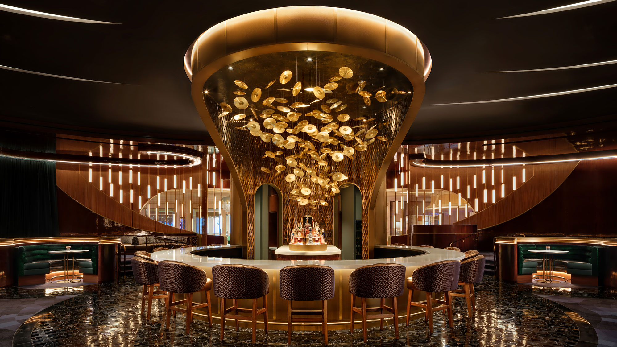 A room with a chandelier and chairs.