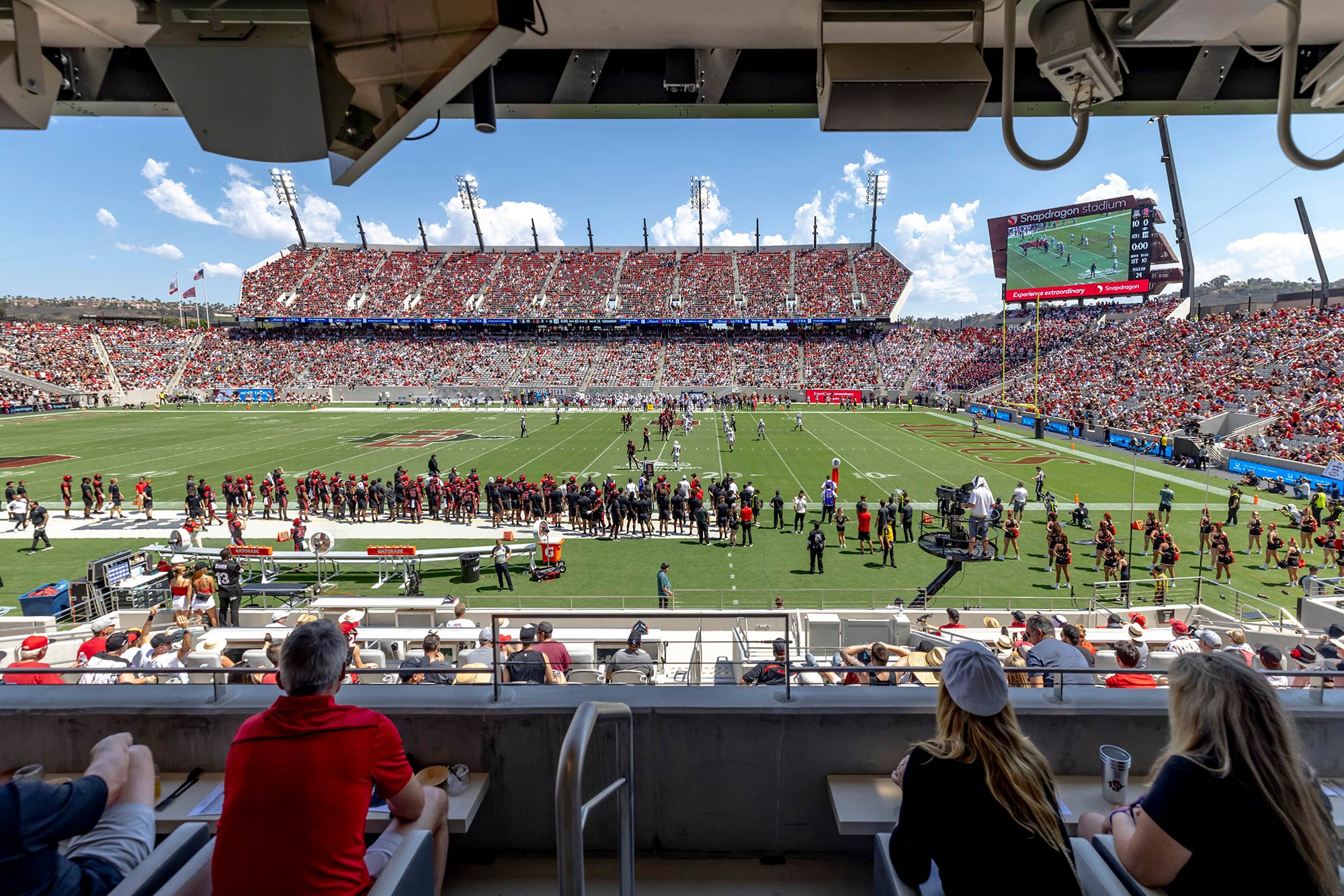 A football stadium with a large crowd with Sun Life Stadium in the background.