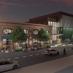 A building with a street and cars.