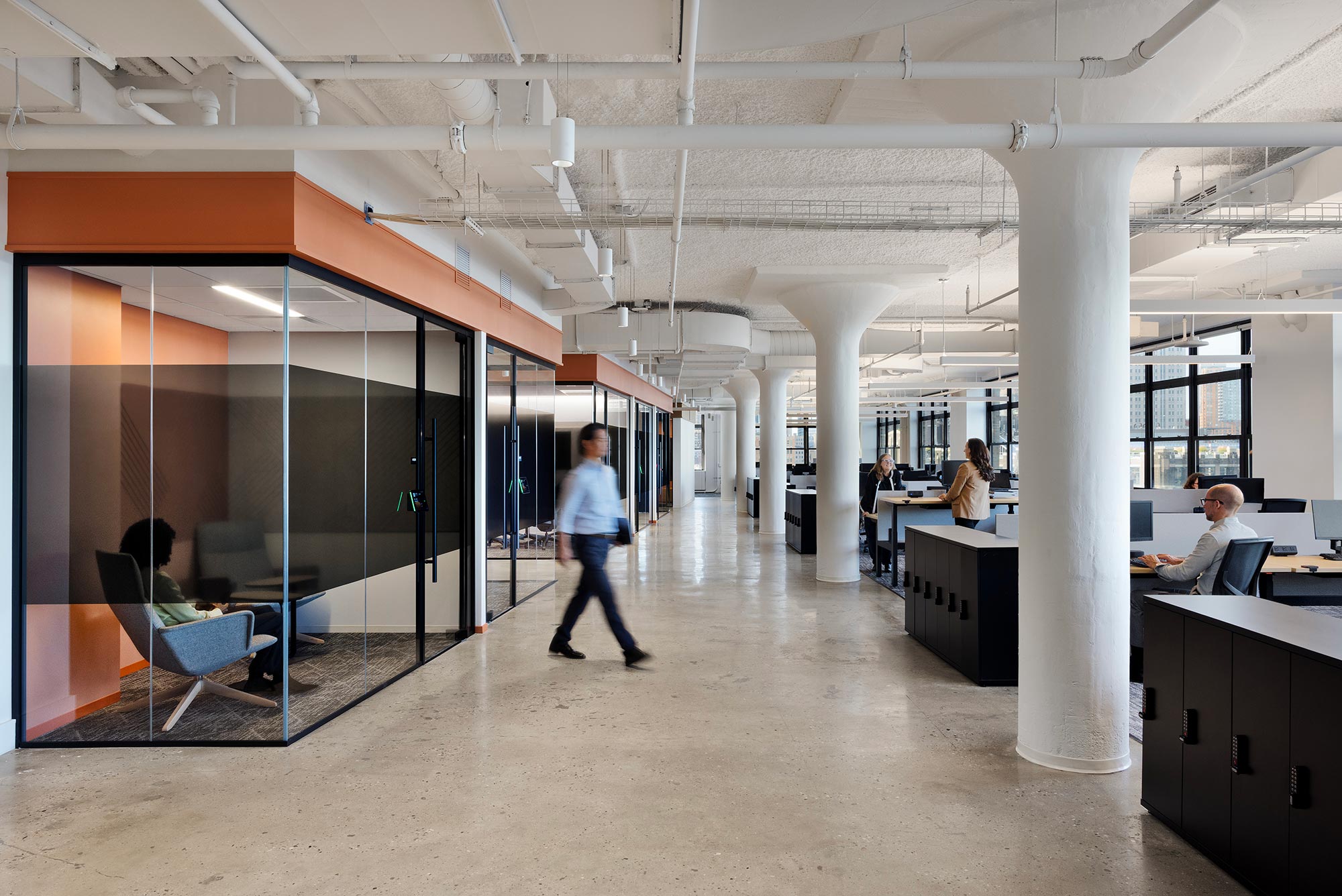 A person walking in an office.