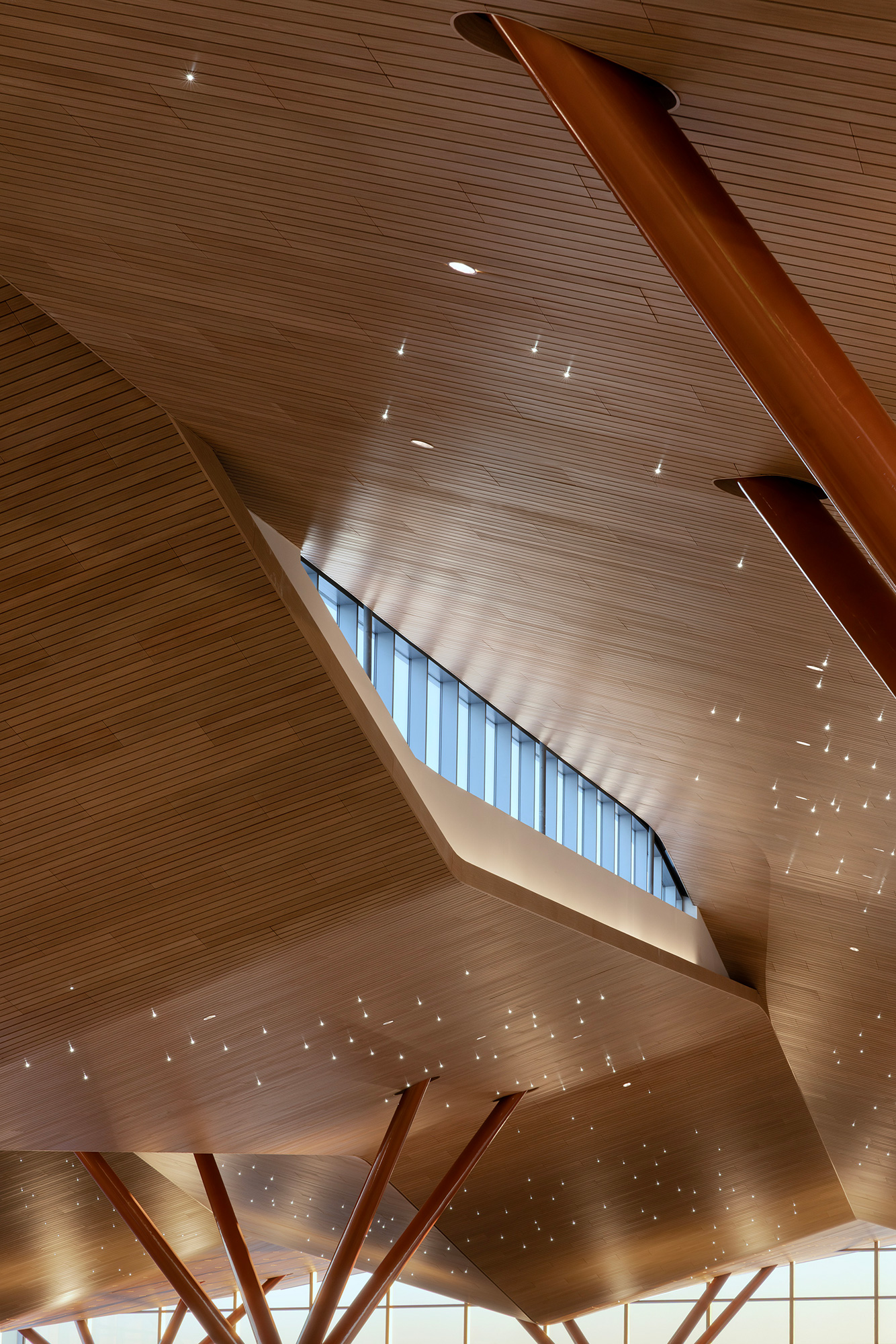 A ceiling with a few pipes.