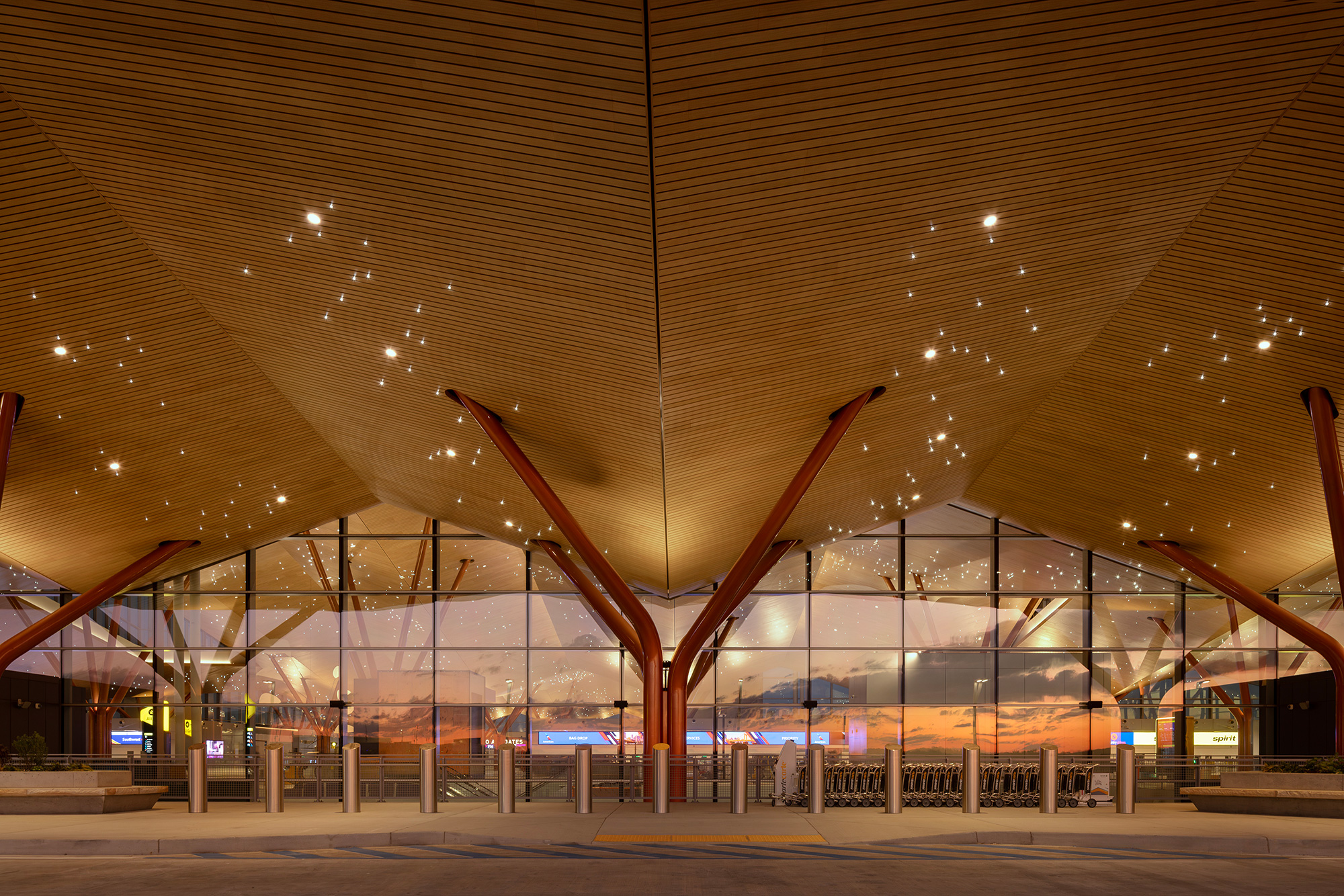 A large building with a large glass wall.