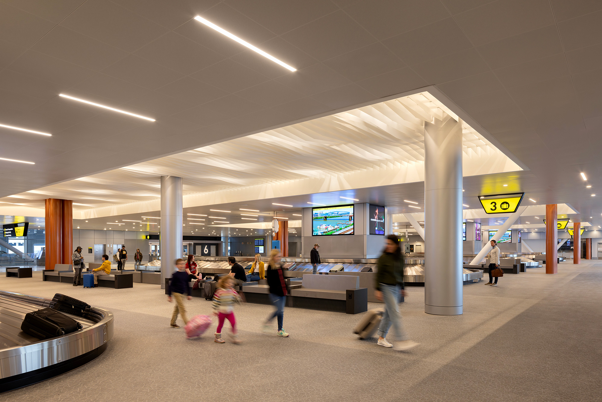 People walking in a large building.