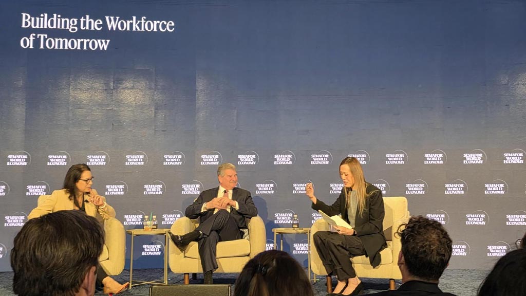 A group of people sitting in chairs.