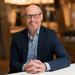 A man wearing glasses.