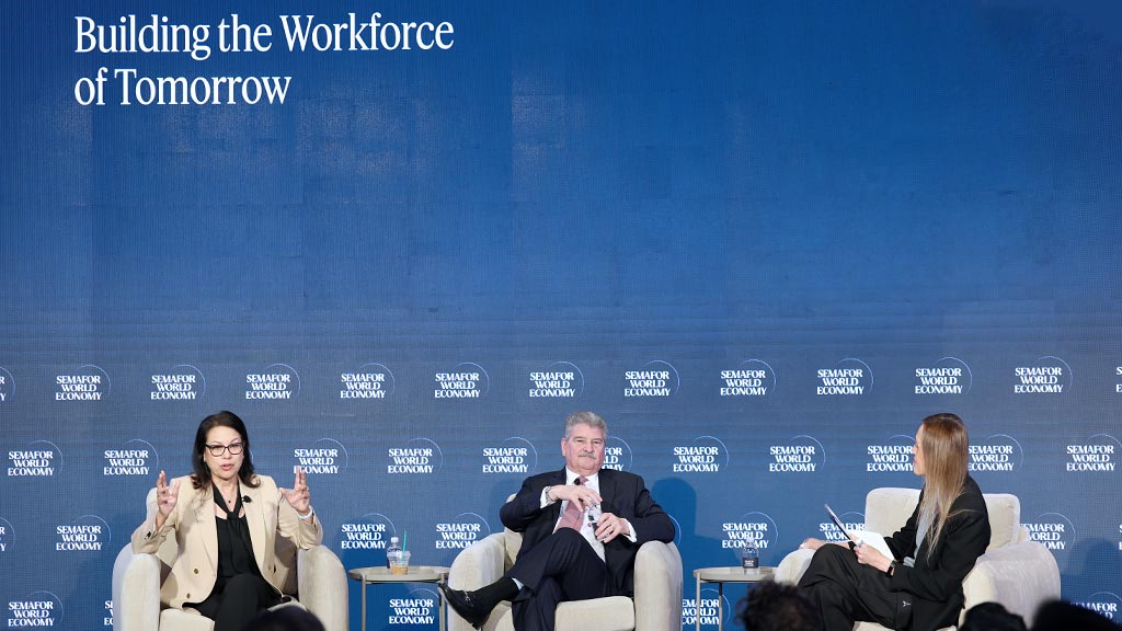 A group of people sitting in chairs.