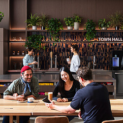 A group of people sitting at a table.