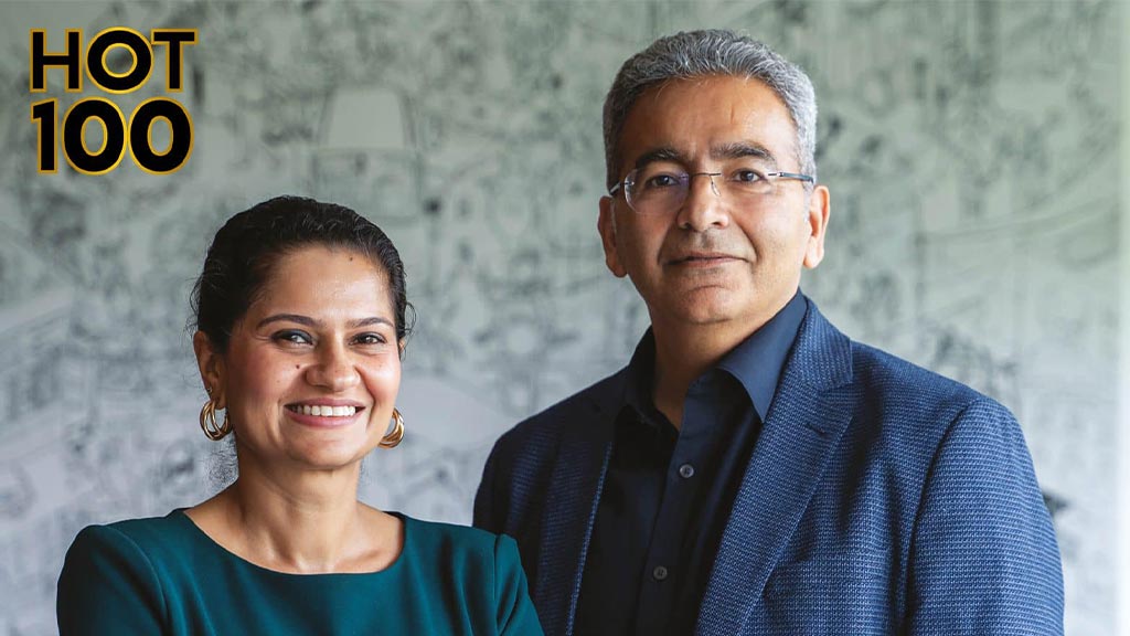 A man and woman smiling.