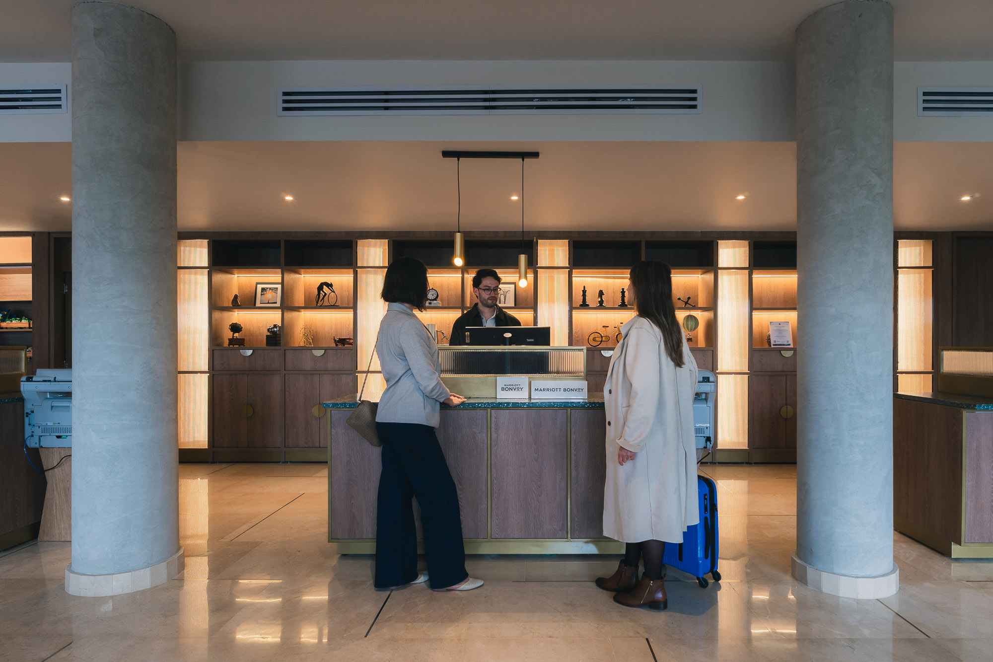 A few people in a waiting area.