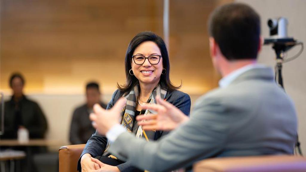 A woman and a man sitting.