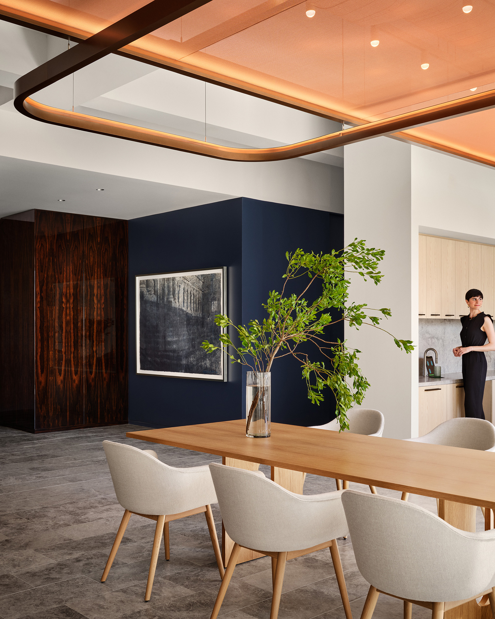 A room with a table and chairs.