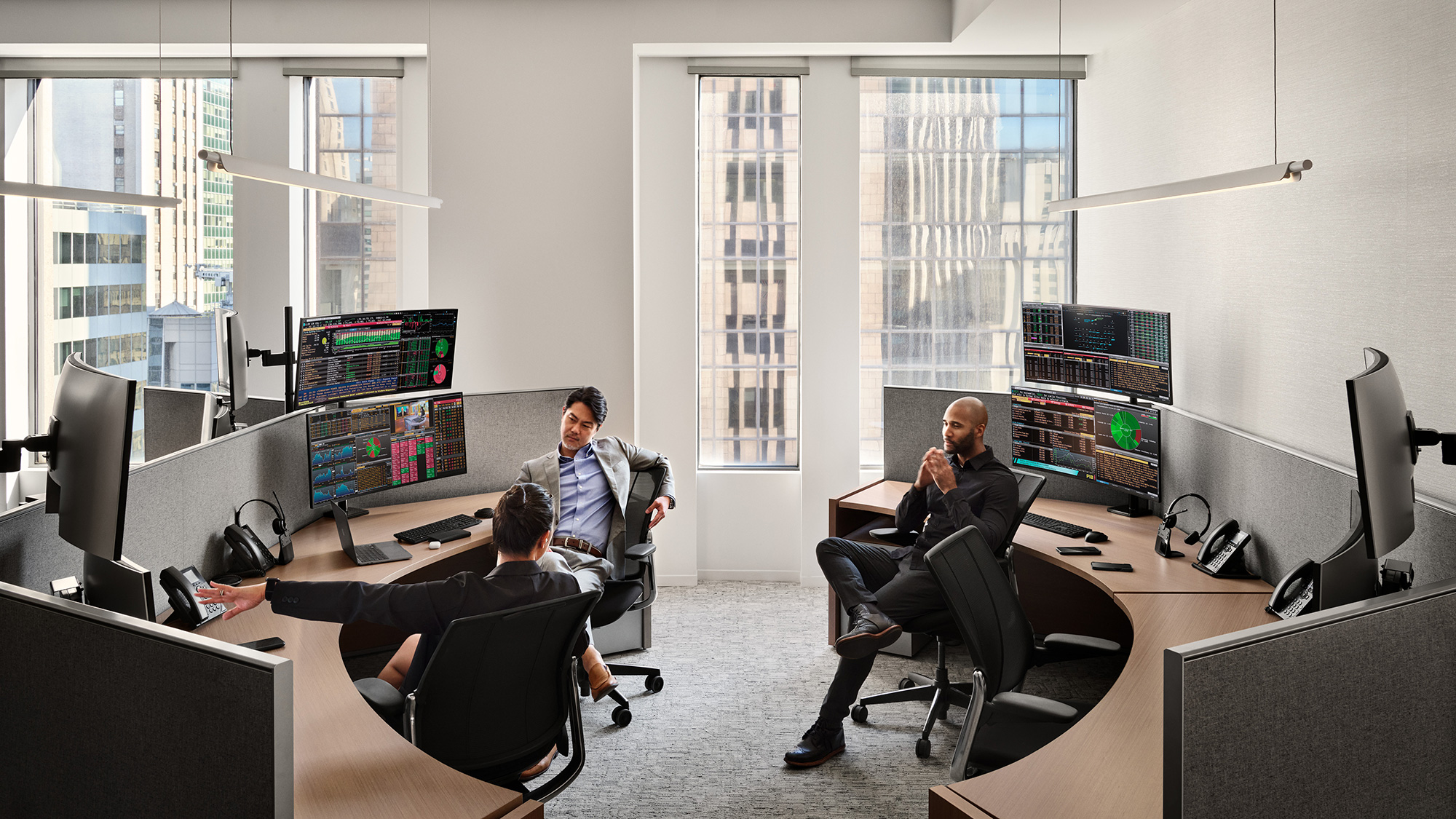 A group of people sitting in an office.