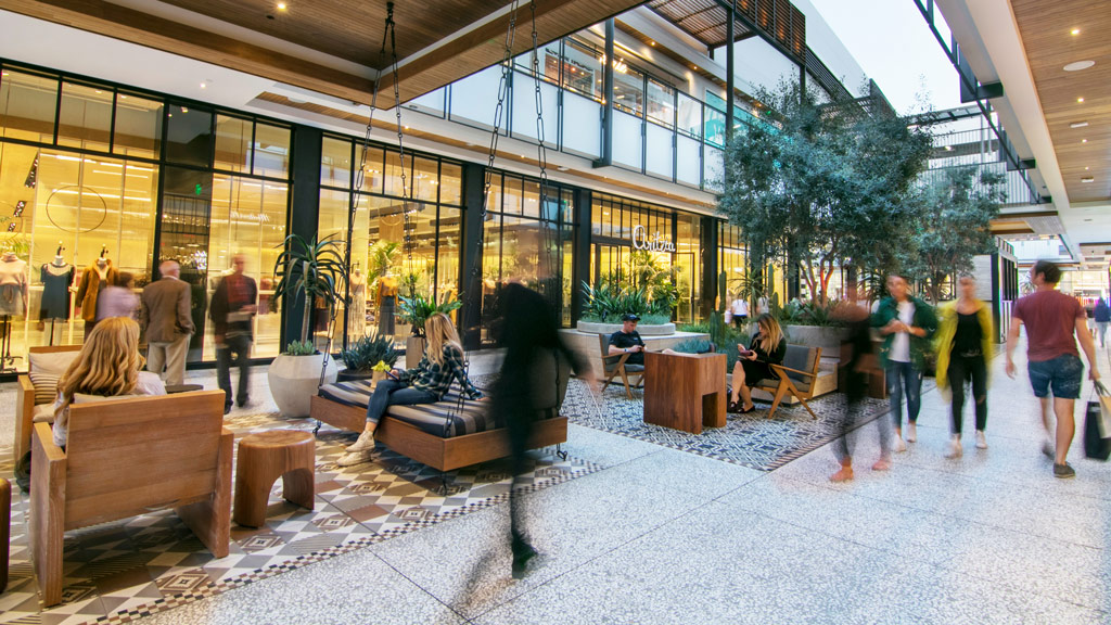 People walking around a building.