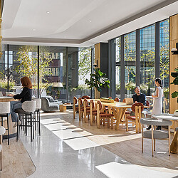 A group of people sitting at tables.
