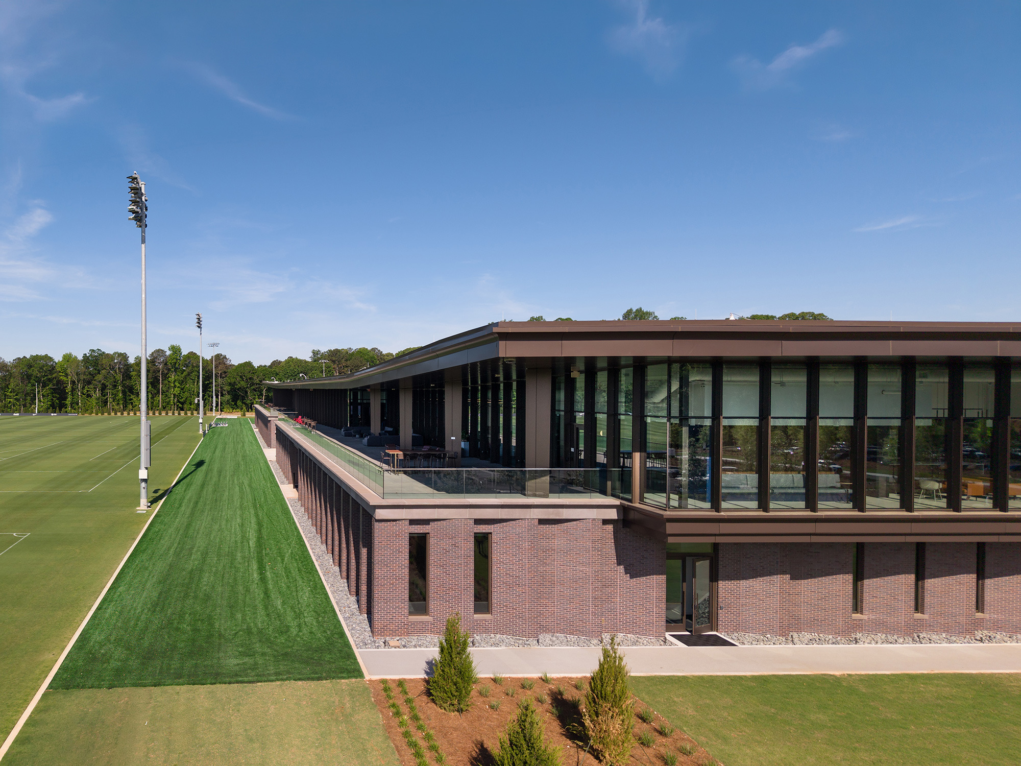 A building with a green lawn.