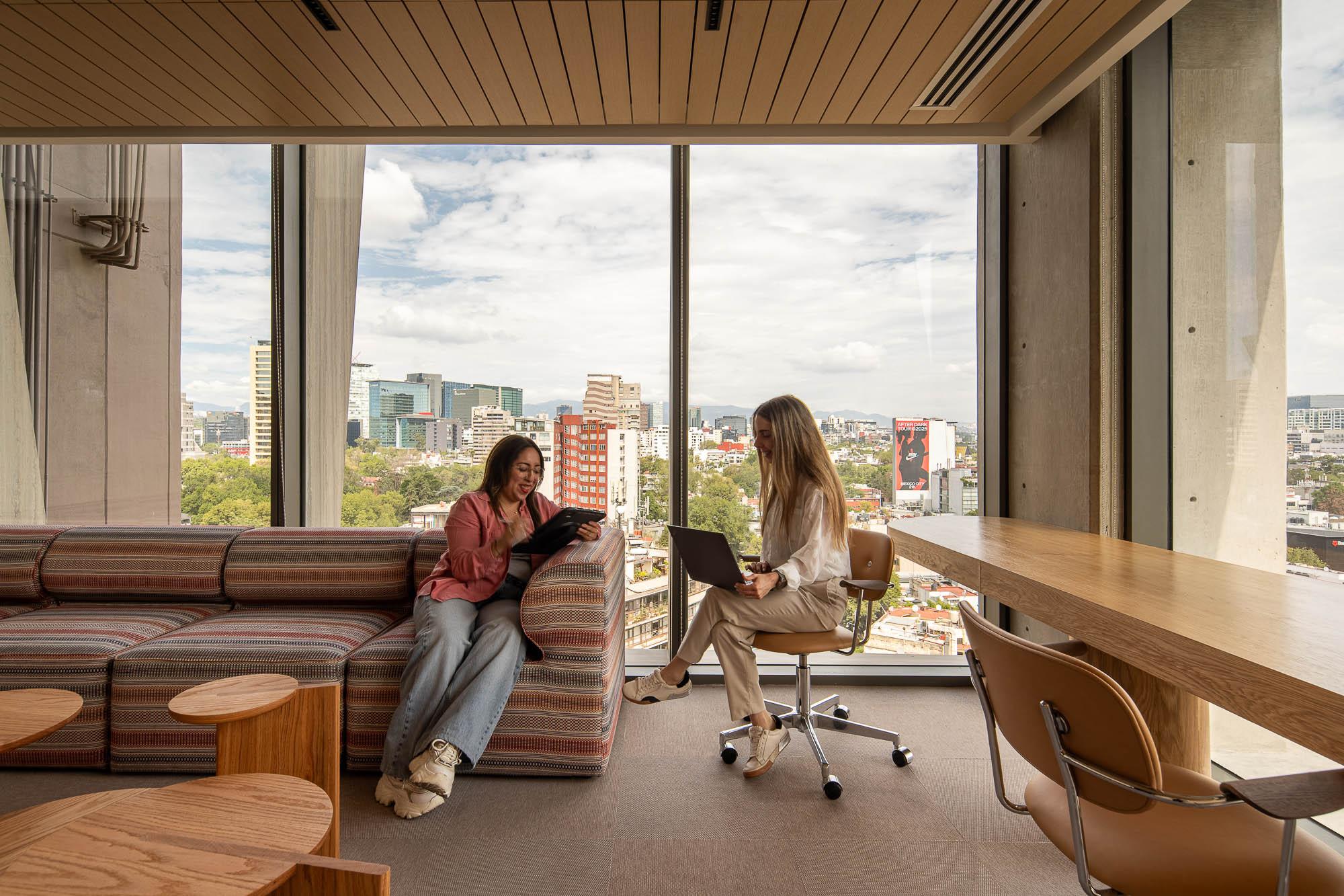 A couple of women sitting in chairs.
