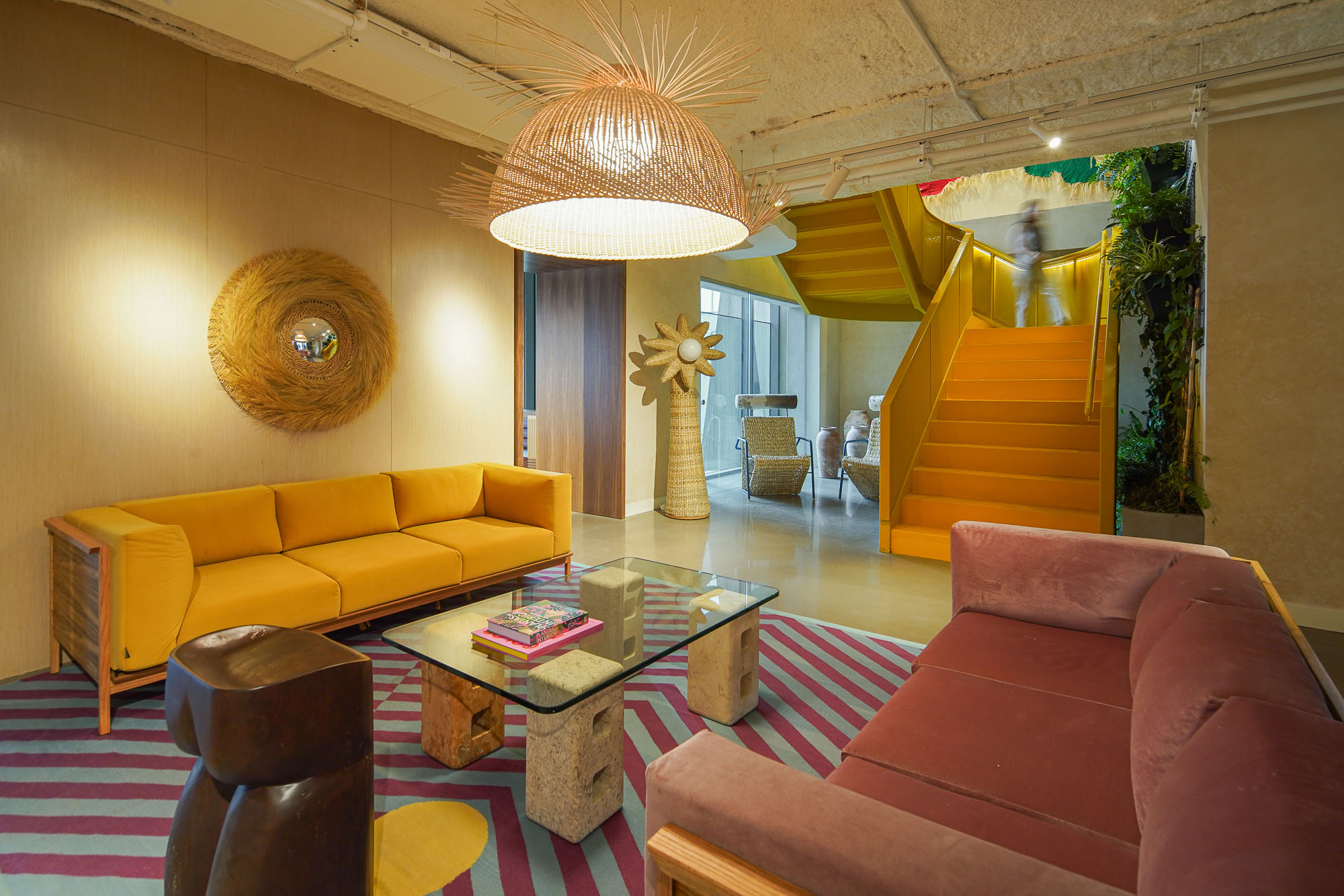 A living room with a chandelier and a couch.
