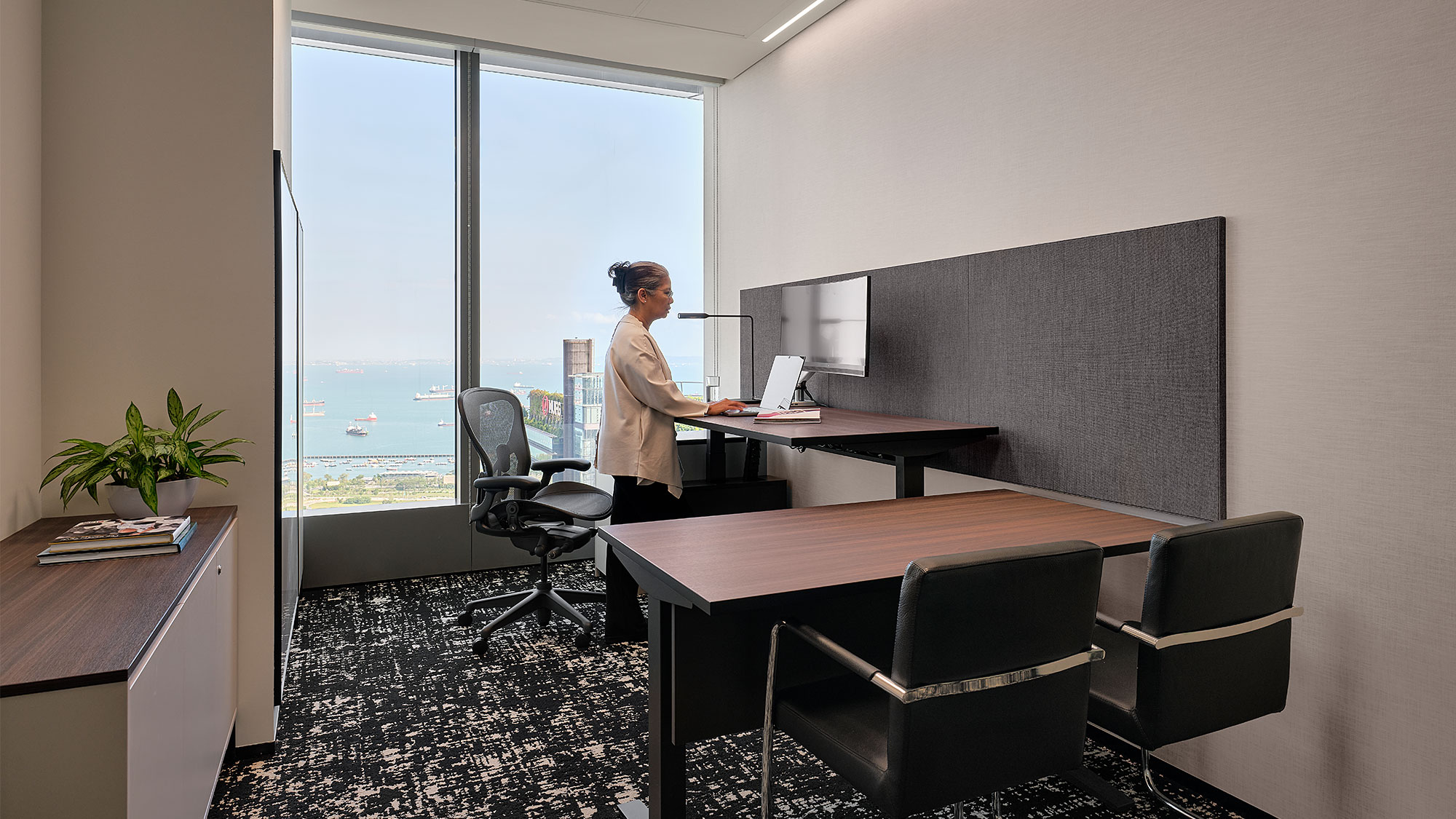 A person standing in an office.