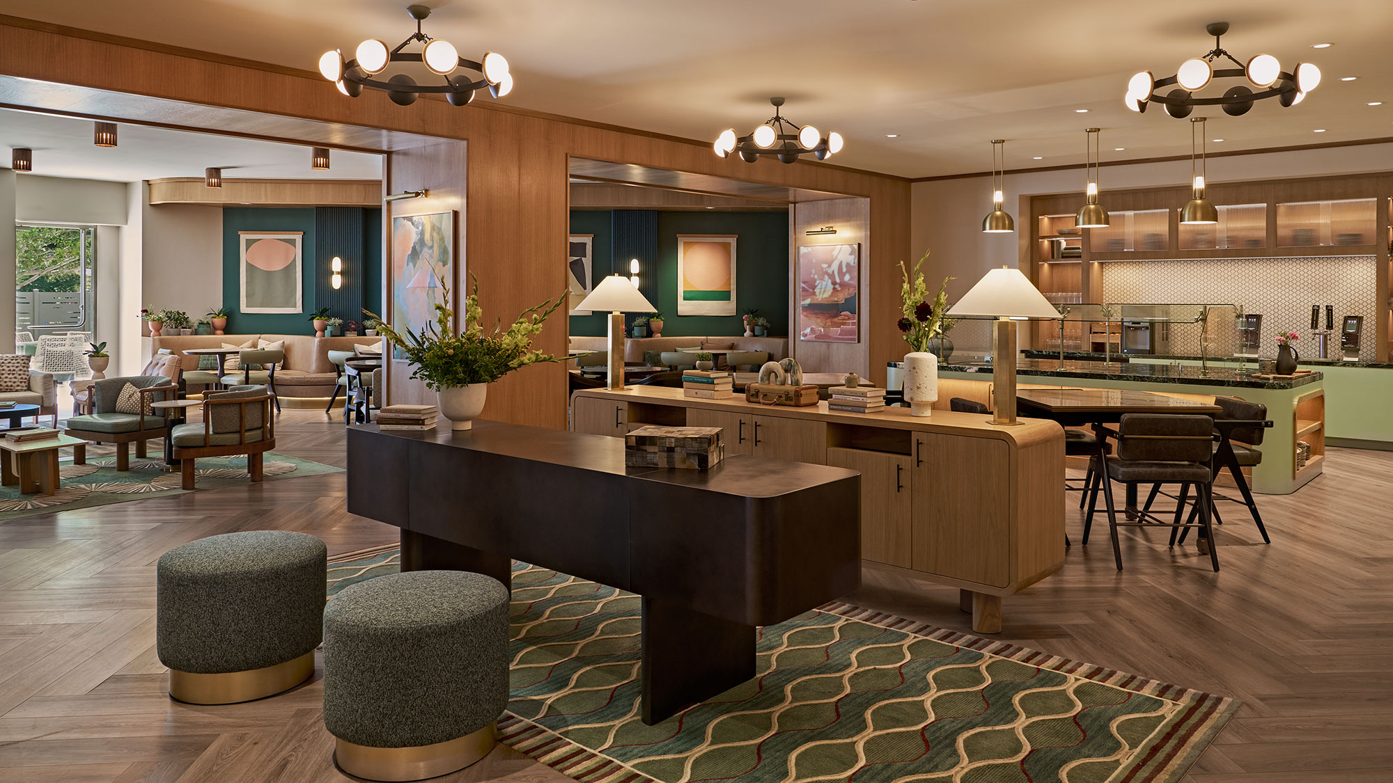 A large kitchen with a bar and chairs.