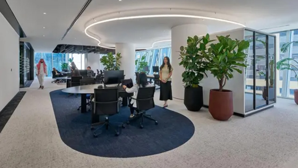 A person standing in an office.