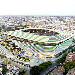 A large stadium with a field.