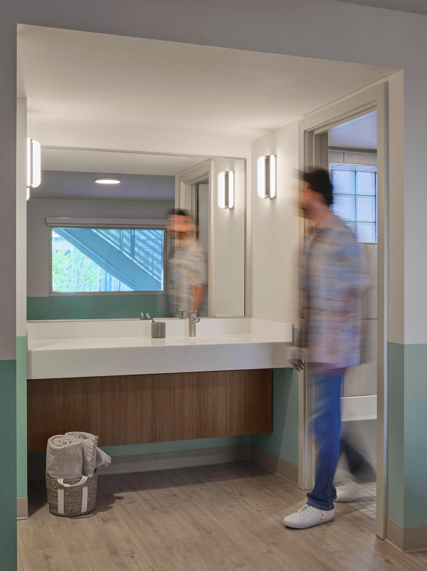 A person standing in a bathroom.