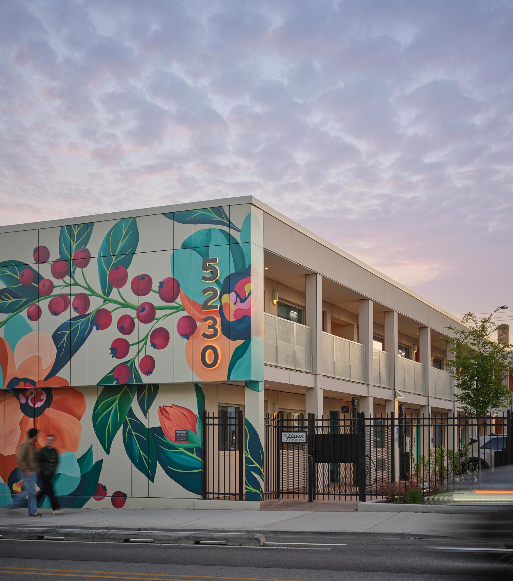 A building with a mural on the side.
