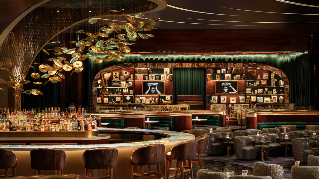 A bar with a large bar and chairs.