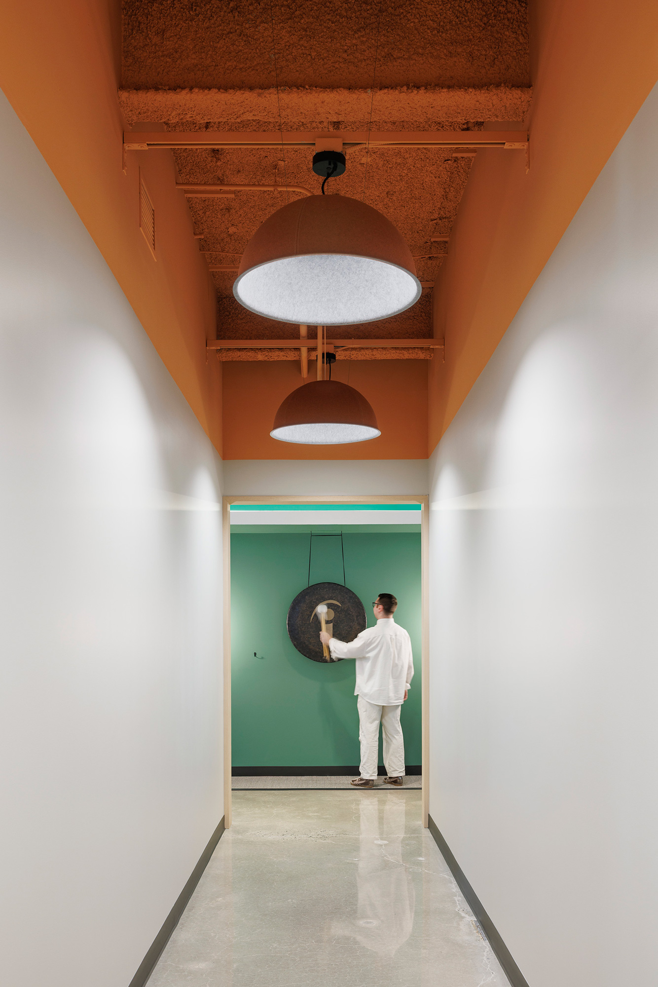 A person standing in a hallway.