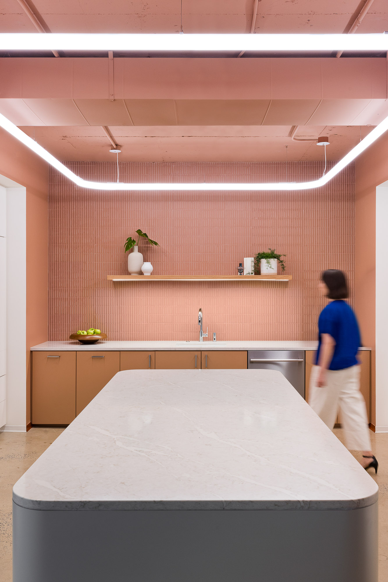 A person walking in a room.