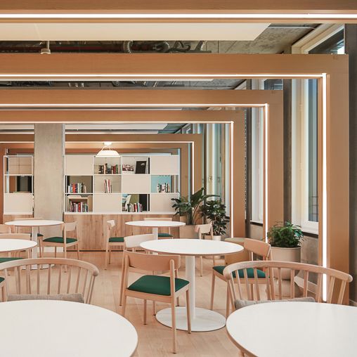 A room with tables and chairs.