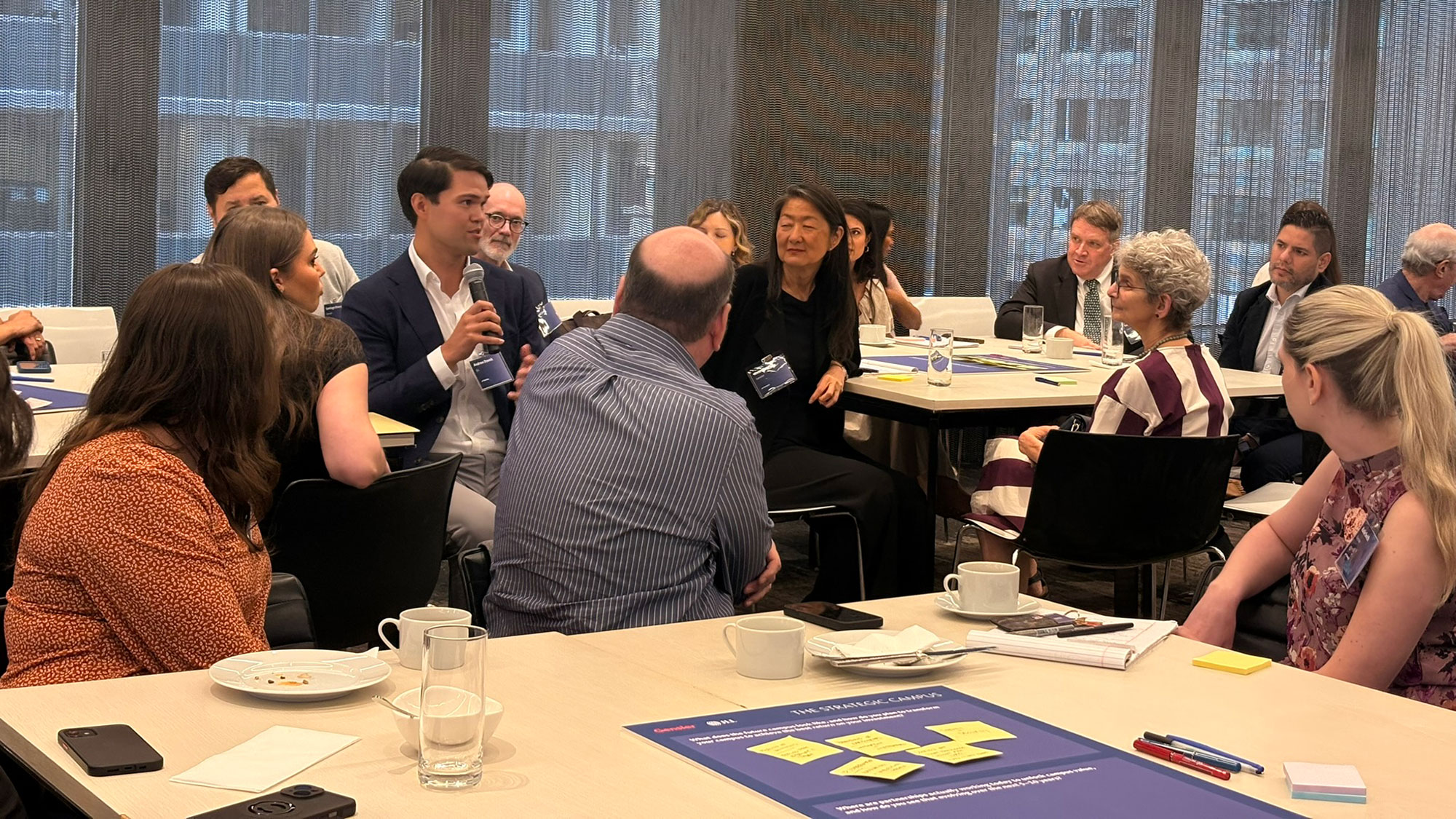 A group of people sitting around a table.