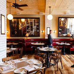 A restaurant with tables and chairs.