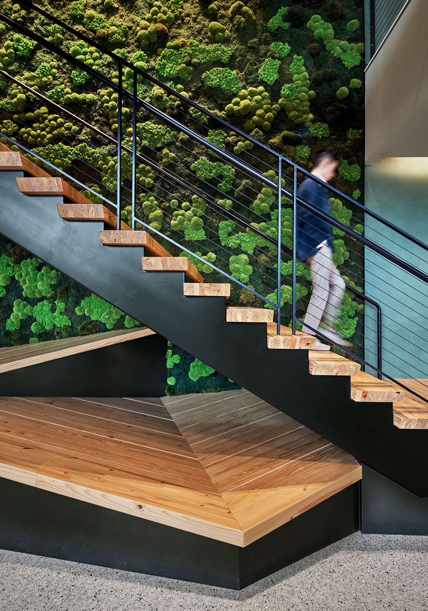 A person standing on a staircase.