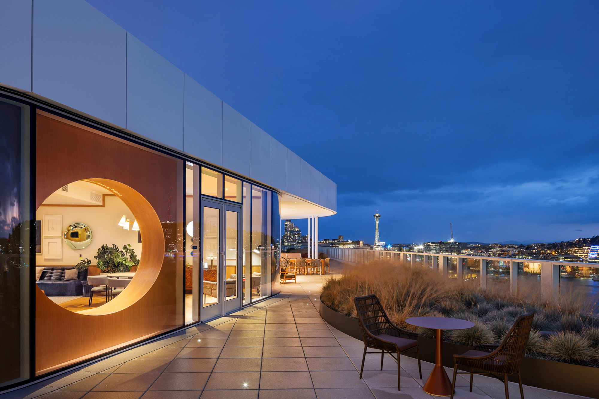 A building with a view of the city and the water.