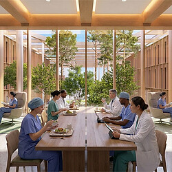 A group of people sitting around a table eating food.