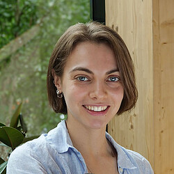 A woman smiling for the camera.