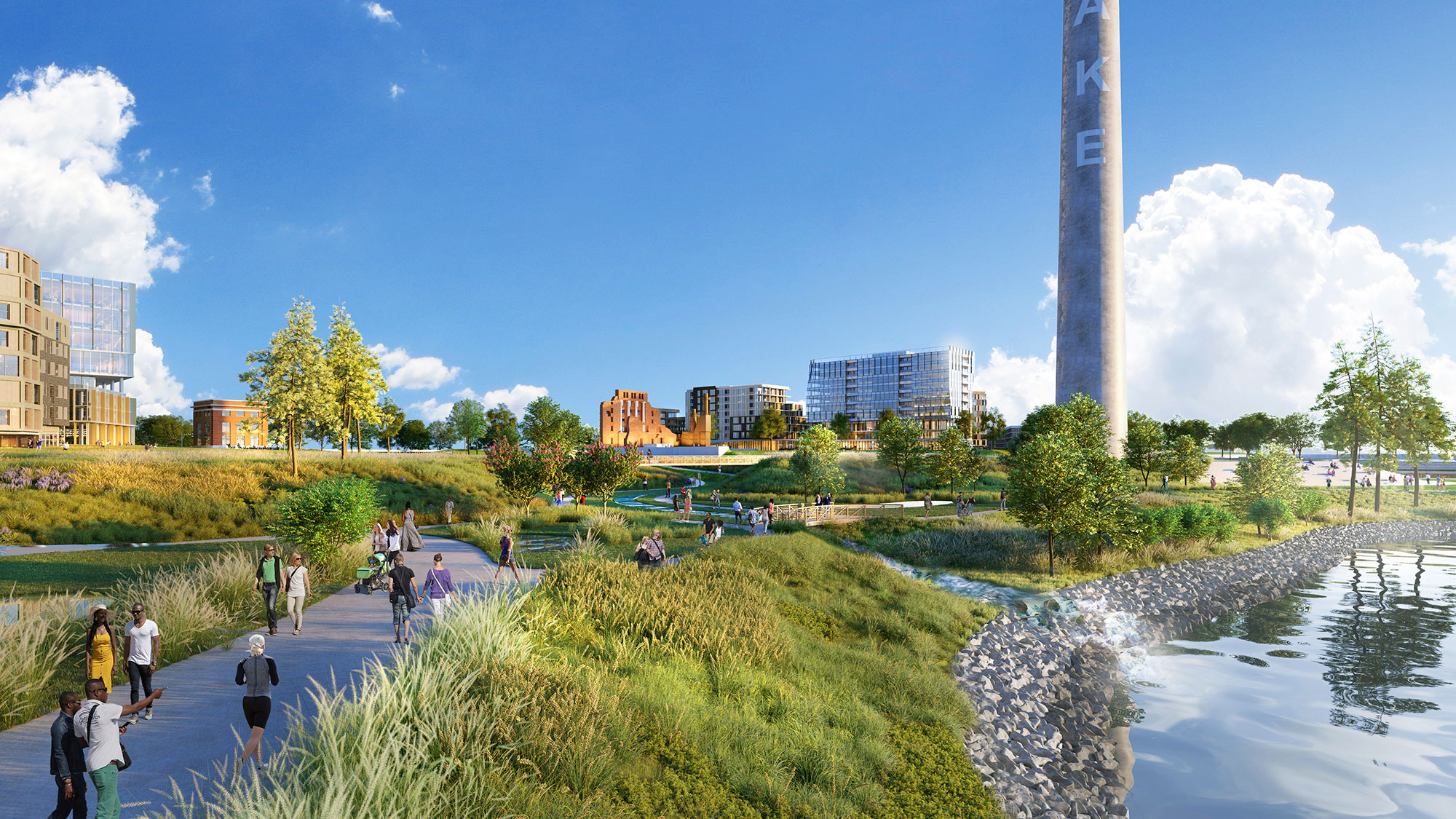 A group of people walking on a path by a tall tower.