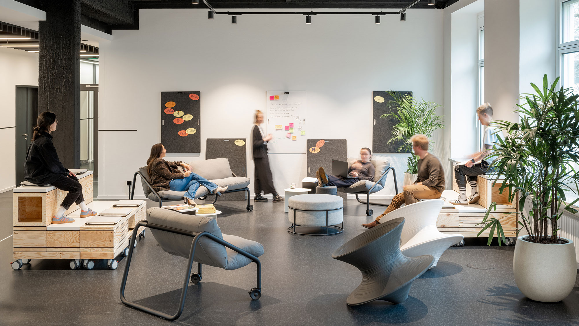 A group of people sitting in a room.