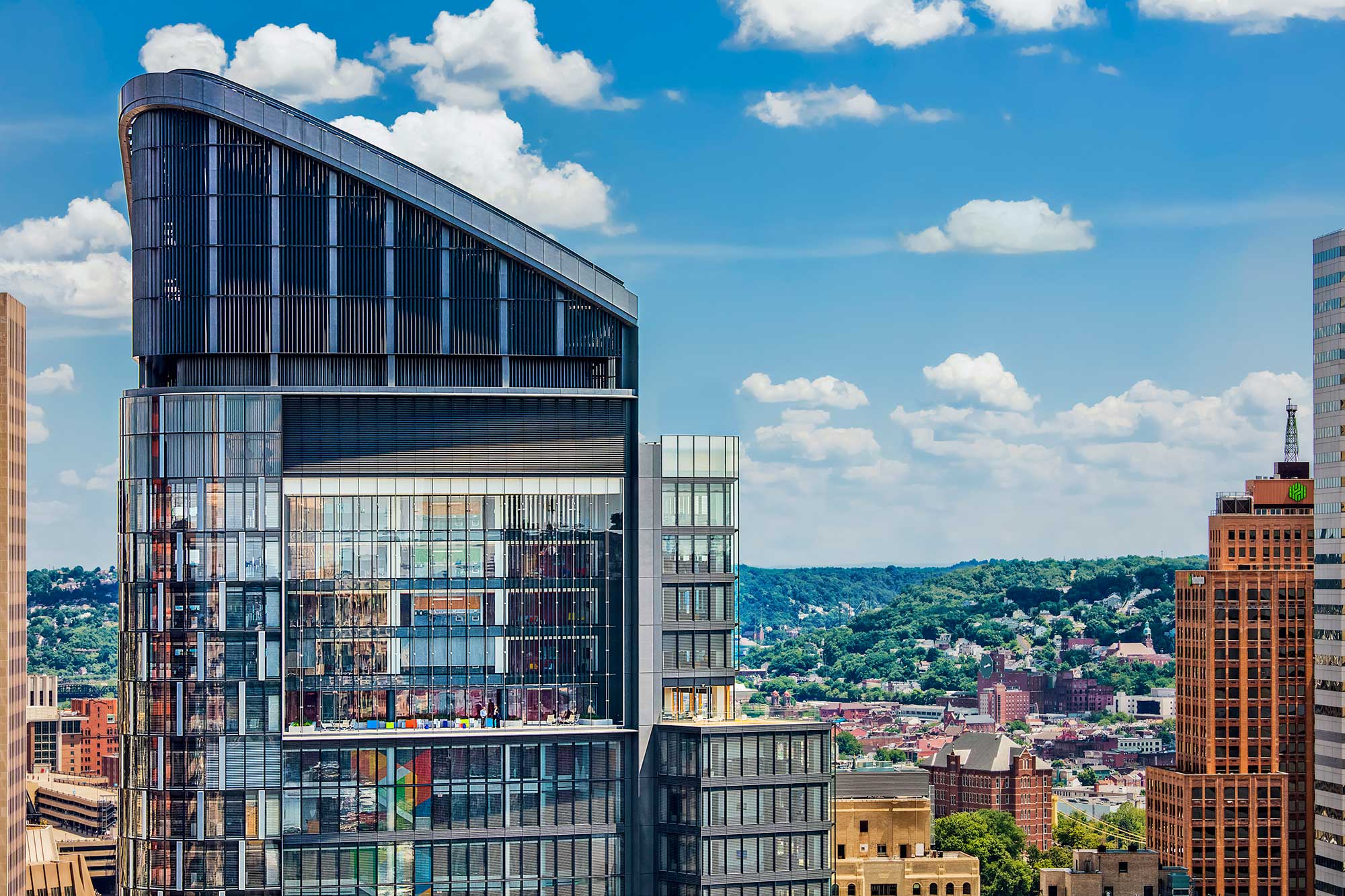 A tall building with a glass front.