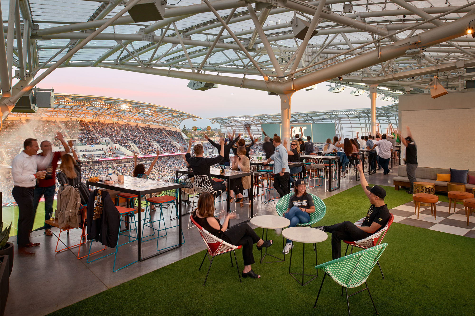 A group of people sitting at tables.