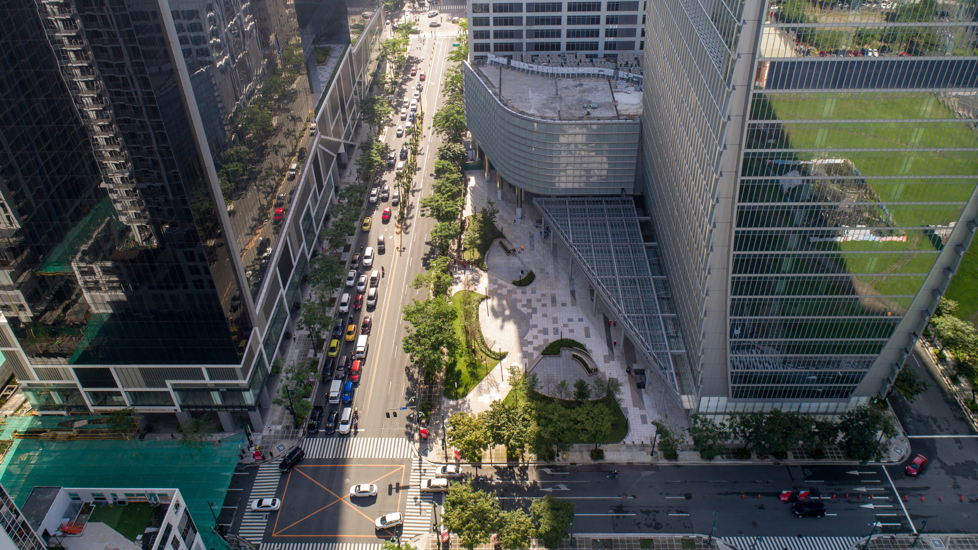 A street with cars and buildings.