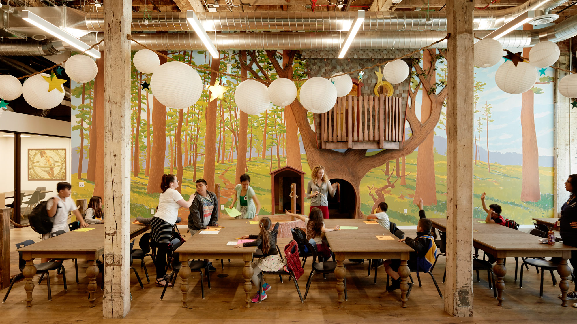 A group of people sitting at tables.