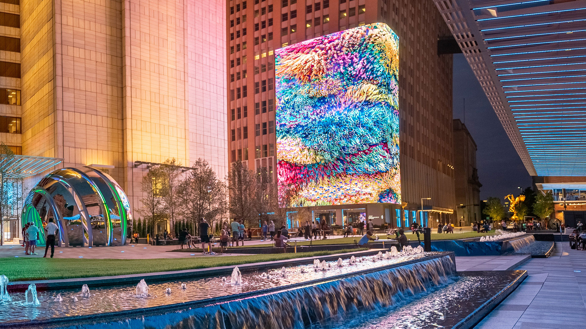 A large colorful building with a fountain in front of it.