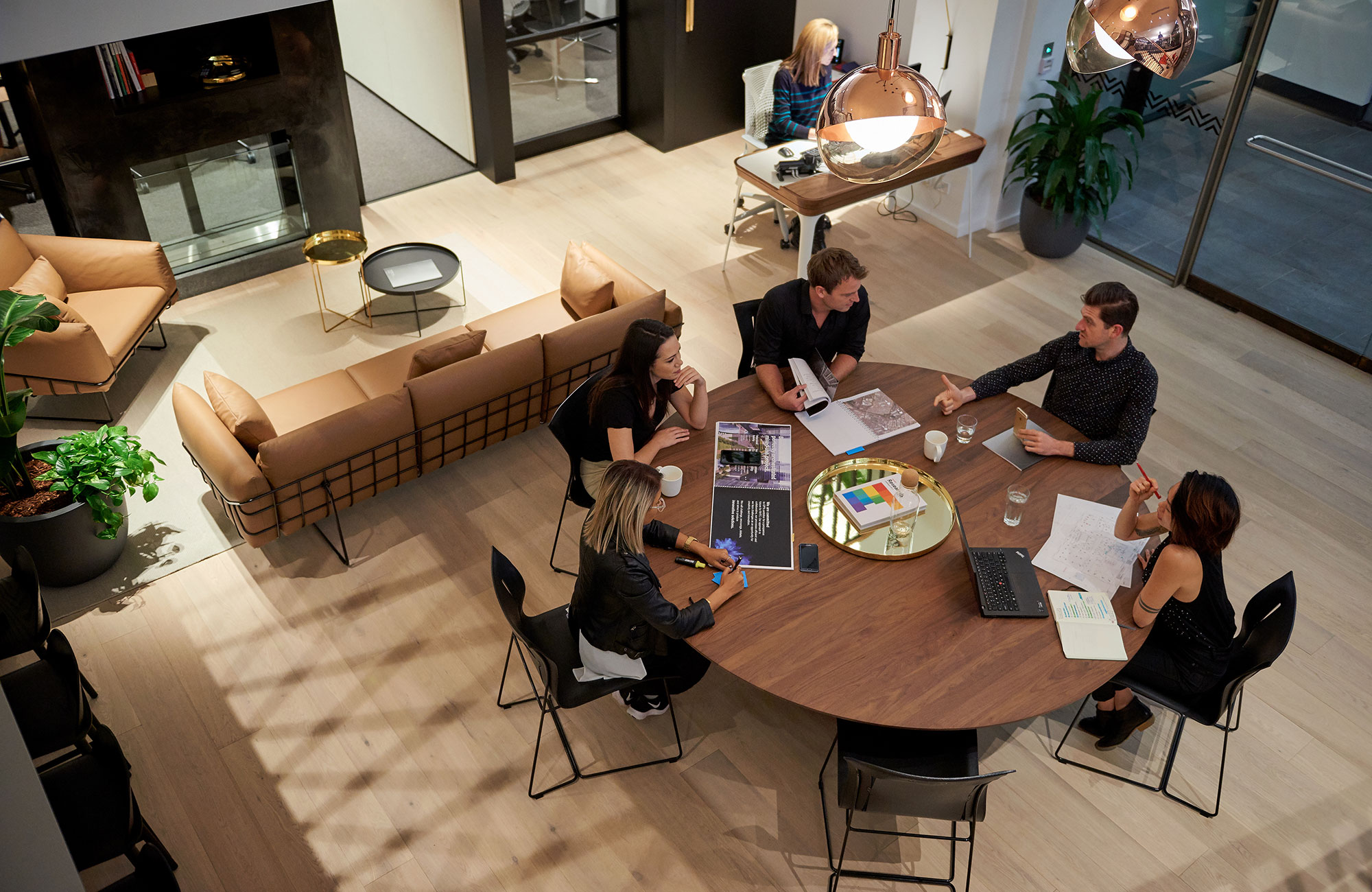 A team collaborates around a table at Gensler's Sydney office.