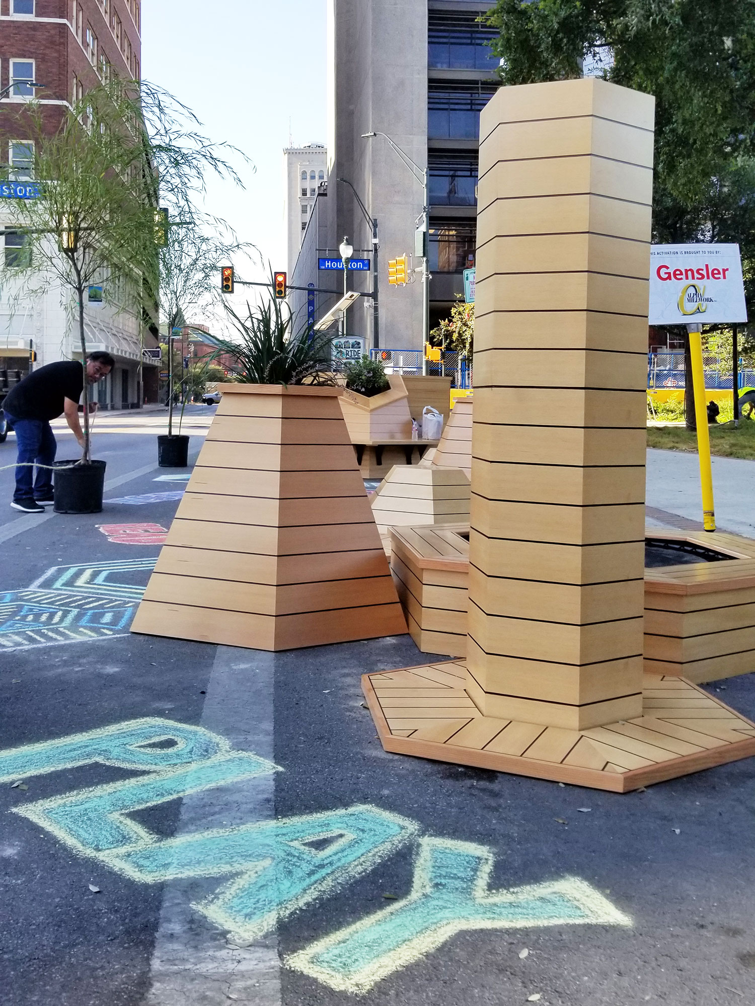 A group of tall blocks on a sidewalk.