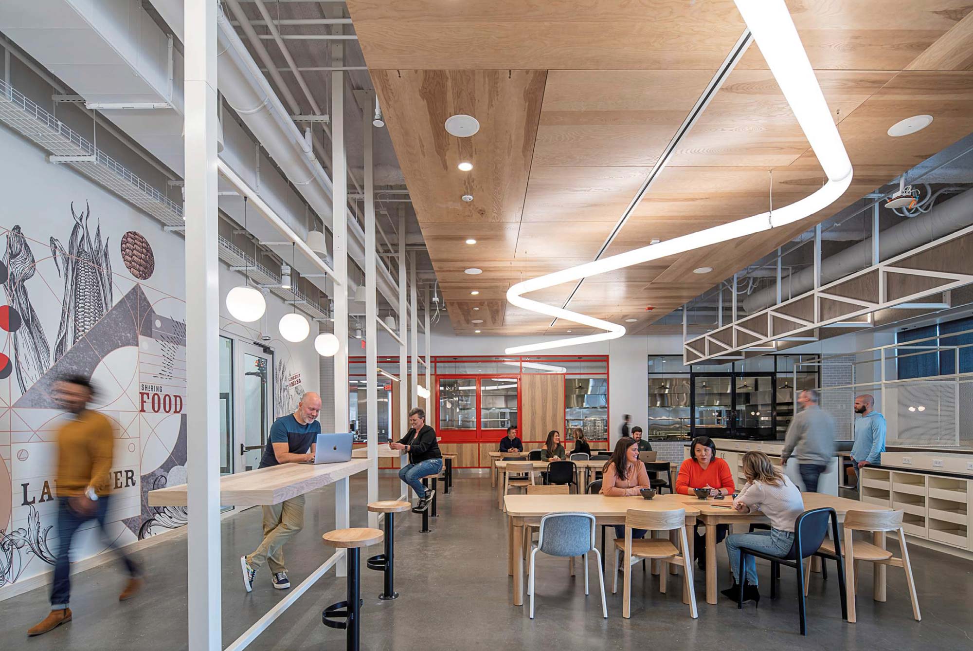 People sitting at tables in a building.