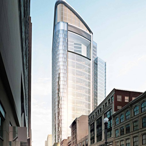 A tall building with a glass front.