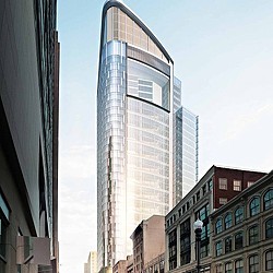 A tall building with a glass front.